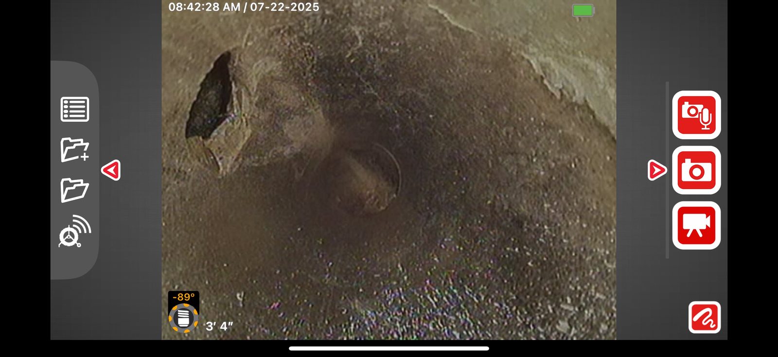 Sewer camera monitor showing the inside of a pipe at three feet four inches, with a timestamp overlay