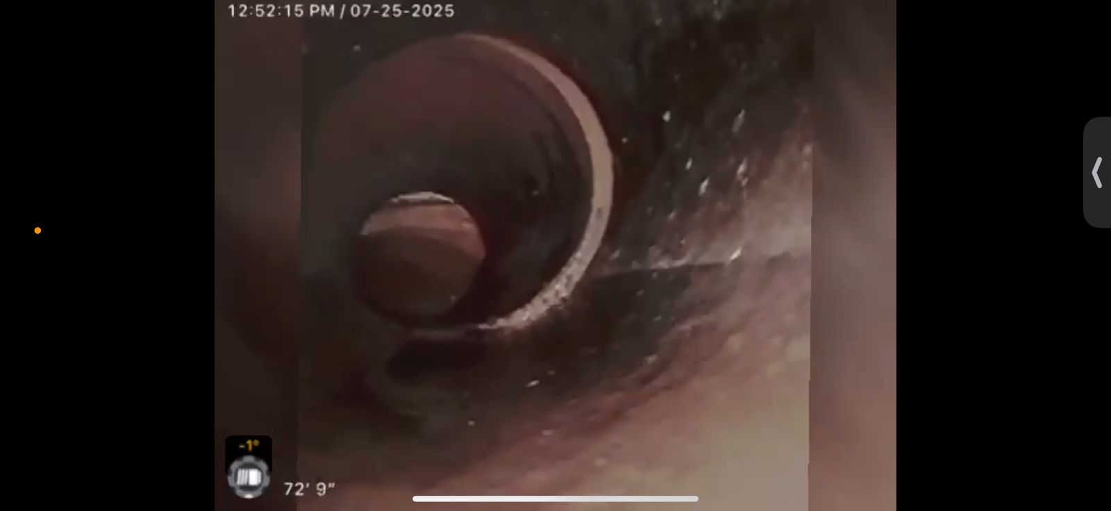 Sewer camera monitor showing the inside of a lateral at seventy-two feet nine inches